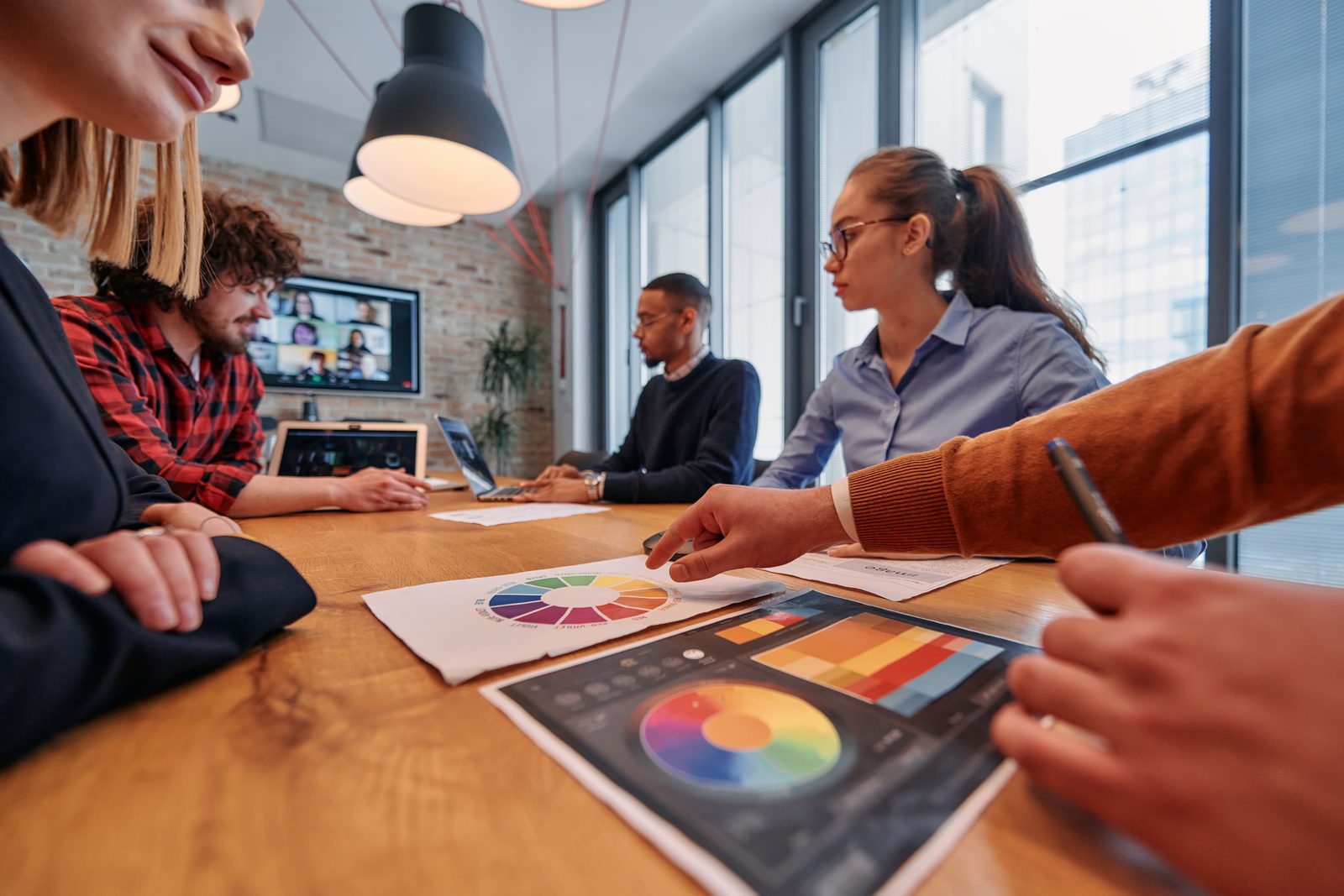 A marketing team meeting with a local business owner