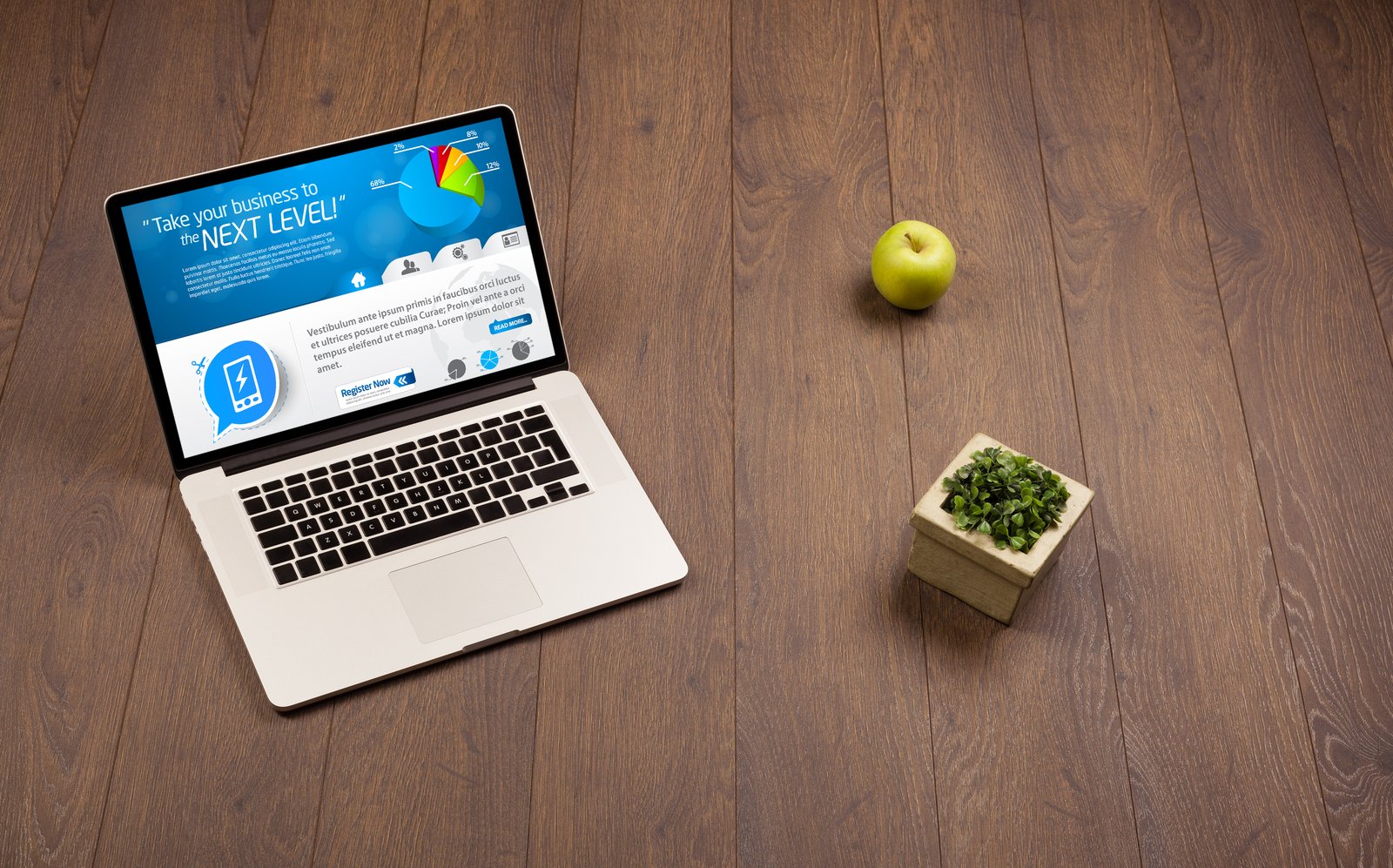 A small business owner in Oklahoma looking at a laptop showing a simple, mobile-friendly landing page next to their phone.