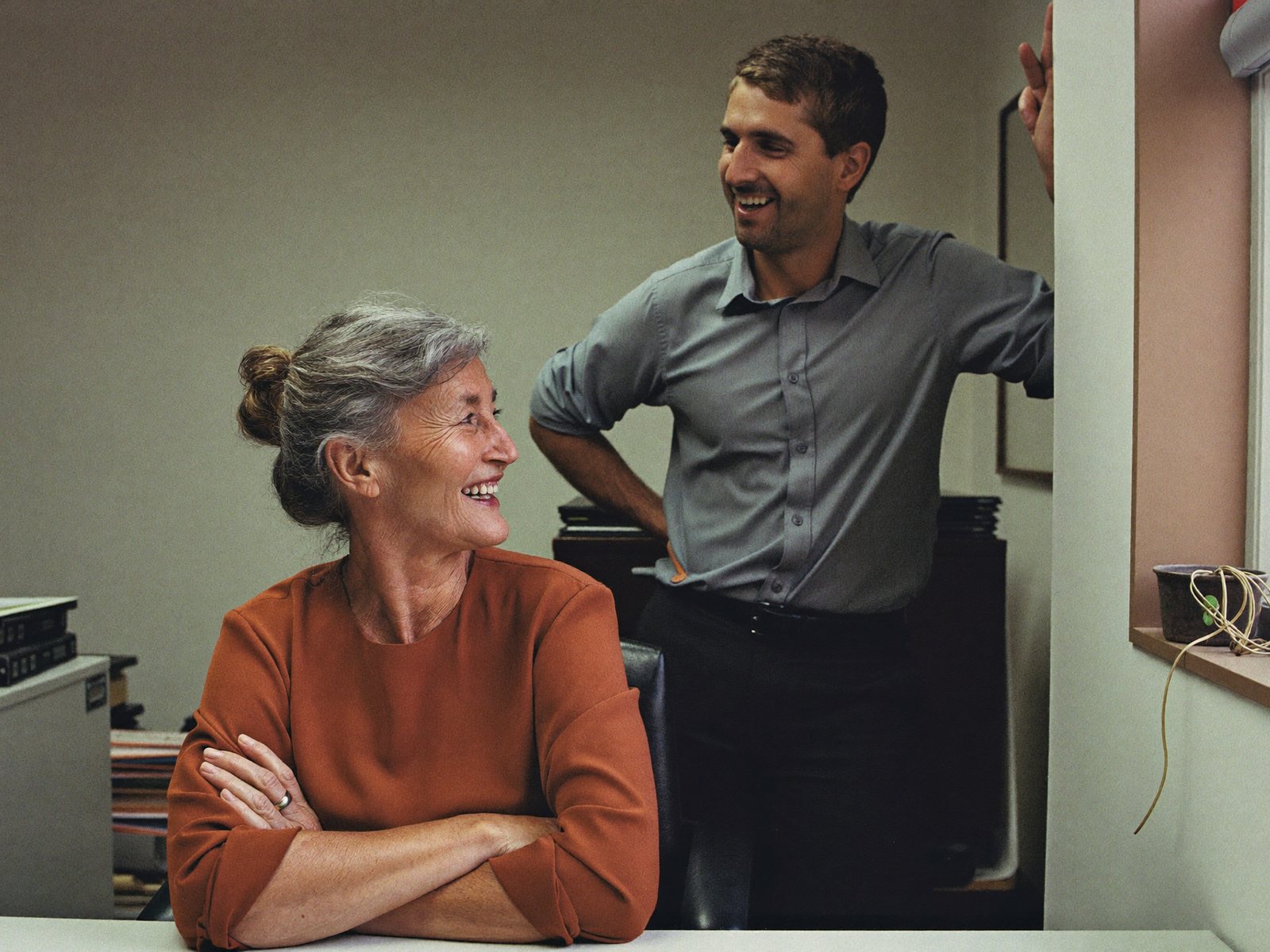 Two attorneys talking in the Merriweather Law office